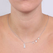 Collana in Argento 925 con scitta LOVE impreziosita da zirconi bianchi pendente, e ciondoli a lato