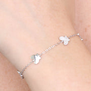 Bracciale in Argento 925 con serie di farfalle lisce e zirconate alternate