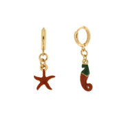 Metal earrings with hanging starfish and pepper