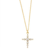 Metal necklace with cross-shaped pendant embellished with pearls