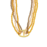 Multi-strand metal necklace with yellow stones