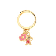 Metal ring with pendants embellished with colored enamels in the shape of a girl and a pink flower