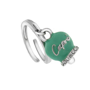 Metal ring with aqua green lucky bell, with embossed Capri writing and white crystals