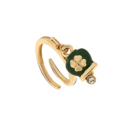 Metal ring with green lucky bell with four-leaf clover