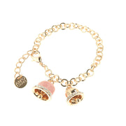 Metal bracelet with pink enameled lucky bell and white crystals