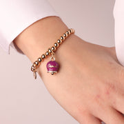 Bracciale in Metallo con campanella pendente viola con scritta Capri