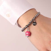 Bracciale in Metallo con campanella fucsia, con scritta Capri e cristalli bianchi