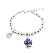 Spherical mesh metal bracelet, with capri written bell pendant embellished with crystals and blue enamel