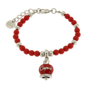 Metal bracelet with pendant bell and red beads