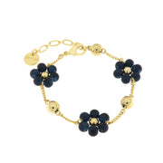 Metal bracelet with blue flower-shaped stones