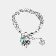 Bracciale in Metallo campana pendente con cristalli azzurri e bianchi